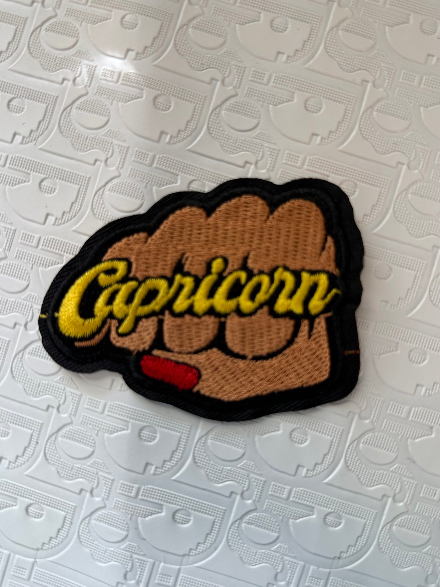 Fist sign iron on patch